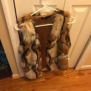 Multi colored Fuax fur vest.